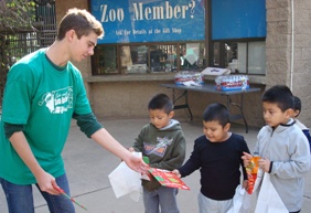 Nick Camarda distributes donated gift-wrapped books