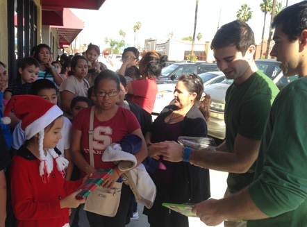 Nick and Michael distributing books at The Path of Hope